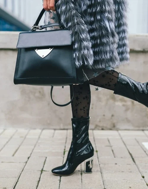 close-up-accessories-details-stylish-woman-walking-city-warm-fur-coat-winter-season-cold-weather-holding-leather-handbag-legs-boots-footwear-street-fashion-trend-large