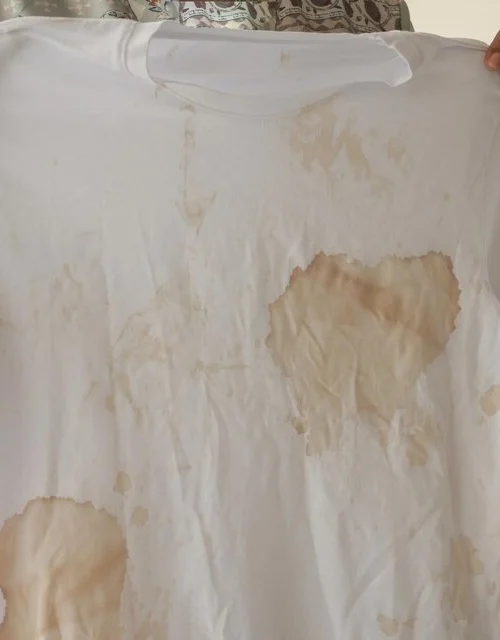 [freepicdownloader.com]-stained-white-tshirt-that-features-noticeable-marks-unpleasant-blemishes-it-large